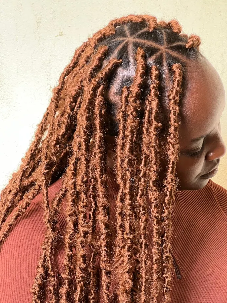 Distressed locs styled by Hair by Akose